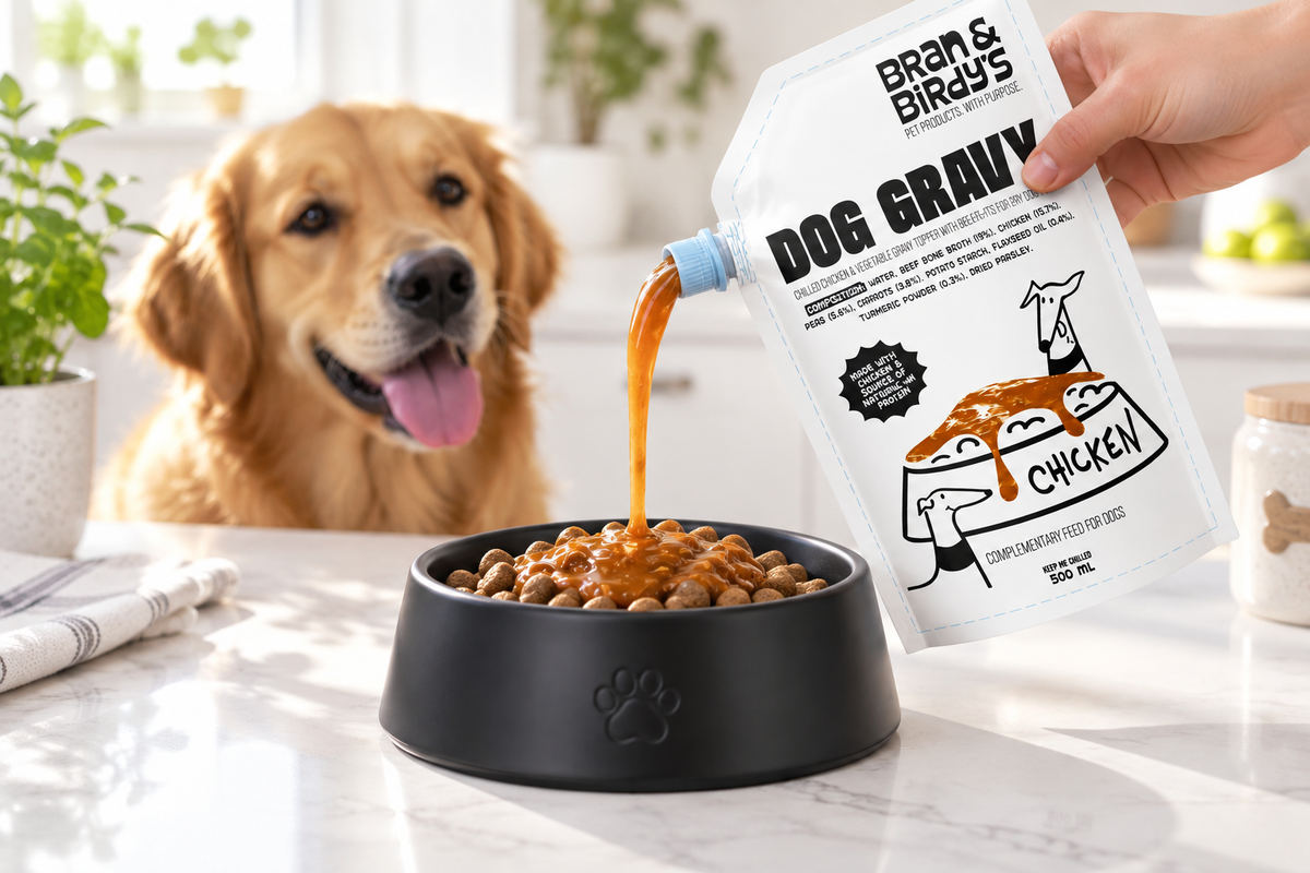 Bran & Birdy's chicken gravy being poured over kibble